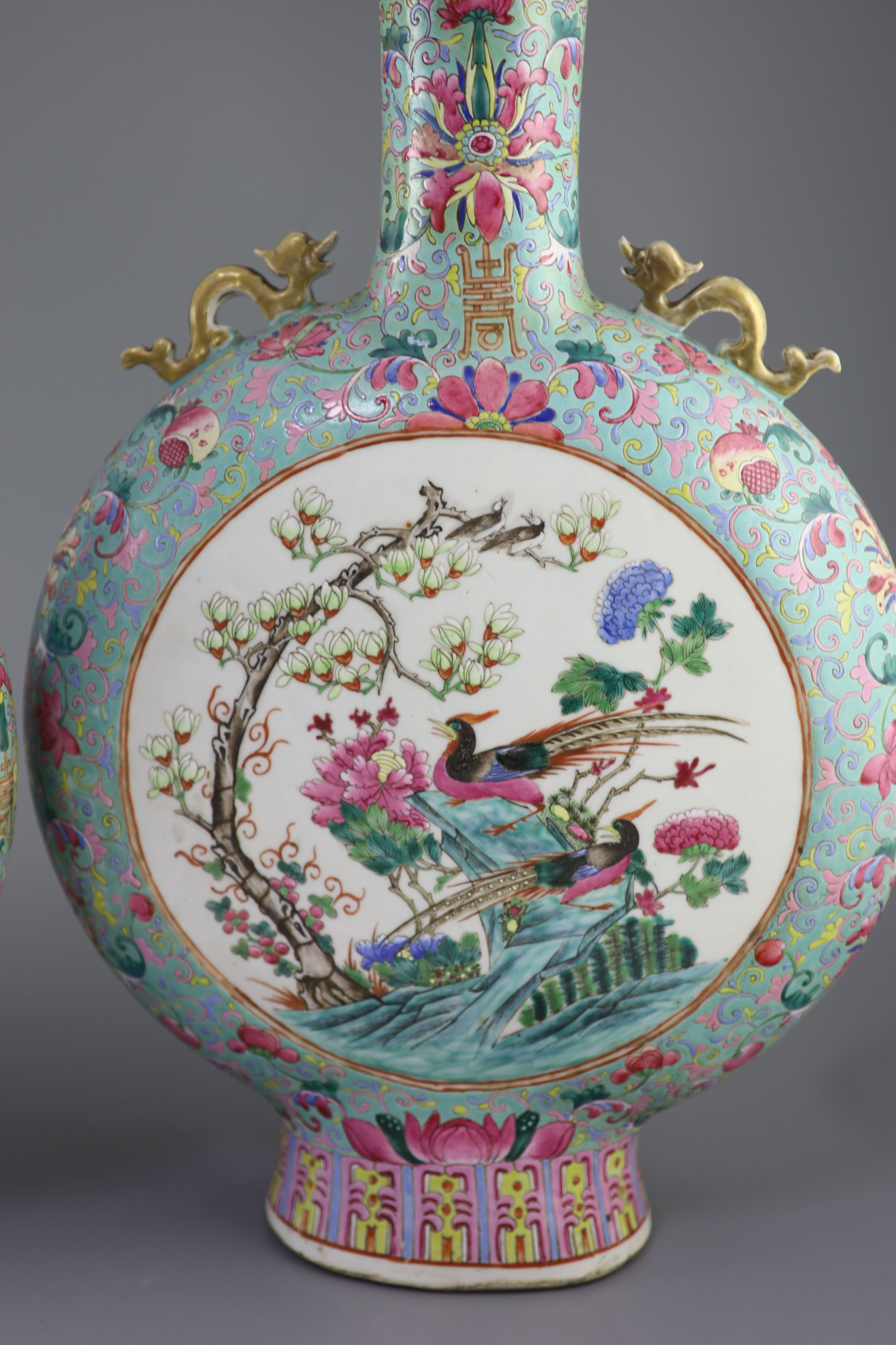 A pair of large Chinese turquoise ground famille rose moon flasks, Tongzhi seal mark and of the period (1862-74), 51cm high, Provenance